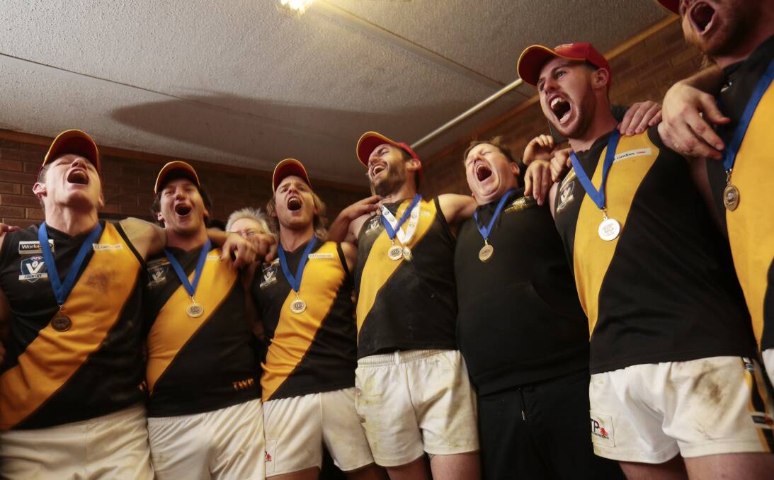 OH WE'RE FROM TIGERLAND: Springbank players belt out the club song in the rooms after beating Buninyong by 29 points.