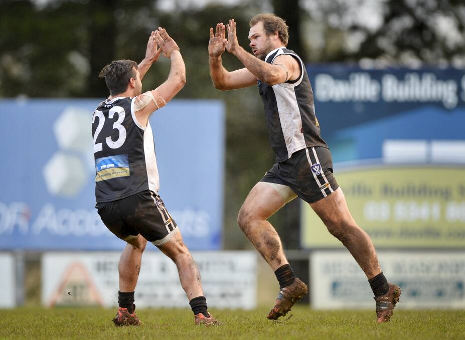 HIGH FIVES: Daniel Harbour and Peter McGettigan celebrate a Dunnstown goal on Saturday. Picture: Dylan Burns.