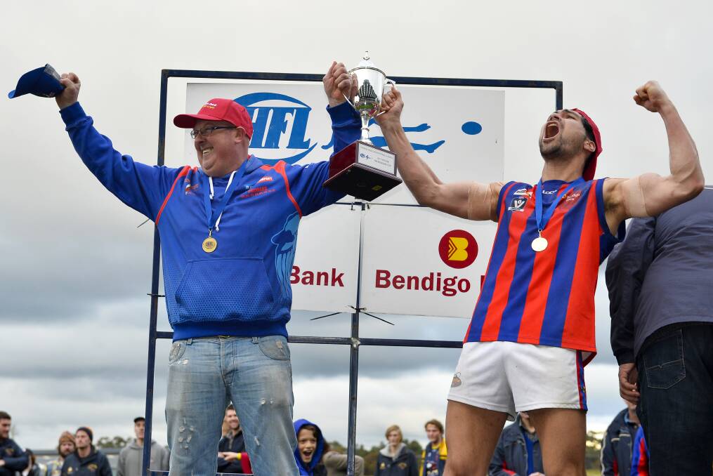 THAT WINNING FEELING: Olver lifts the Central Highlands Football League premiership cup with Burras captain Segifili Asa Leausa.