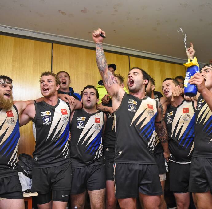 SING IT LOUD: Players belt out the Smythesdale club song after the match as supporters cram the rooms to join in on the celebrations.