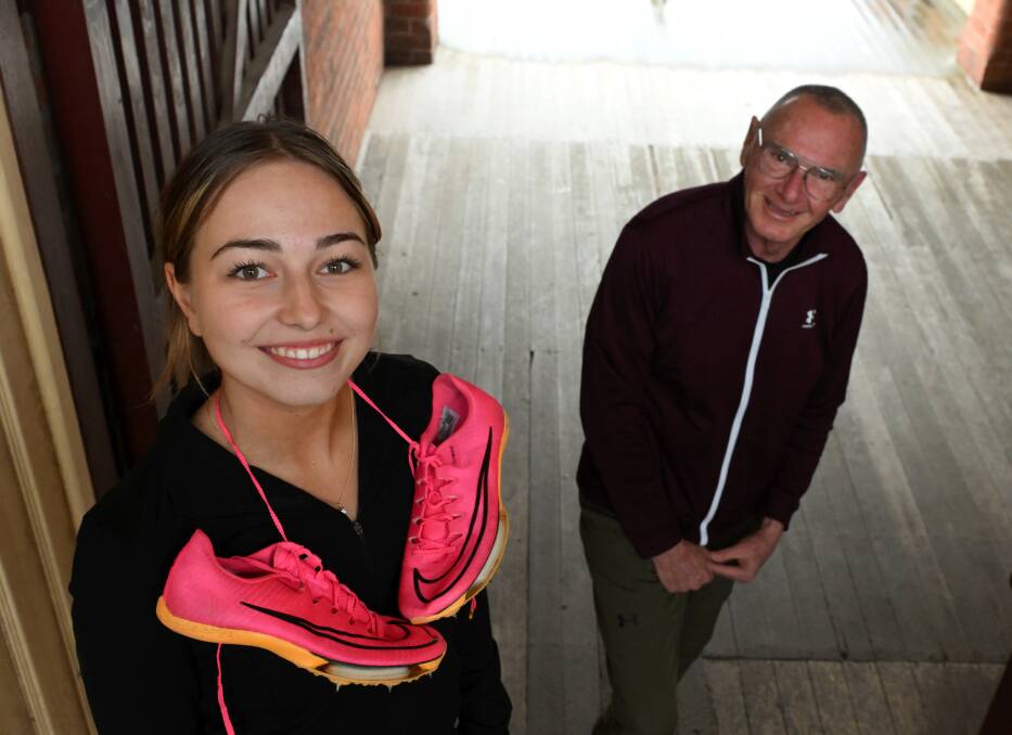Armani Anderson with coach Gerrard Keating. Anderson has been named in the 100m in her first national team for the Oceania Championships. Picture by Lachlan Bence