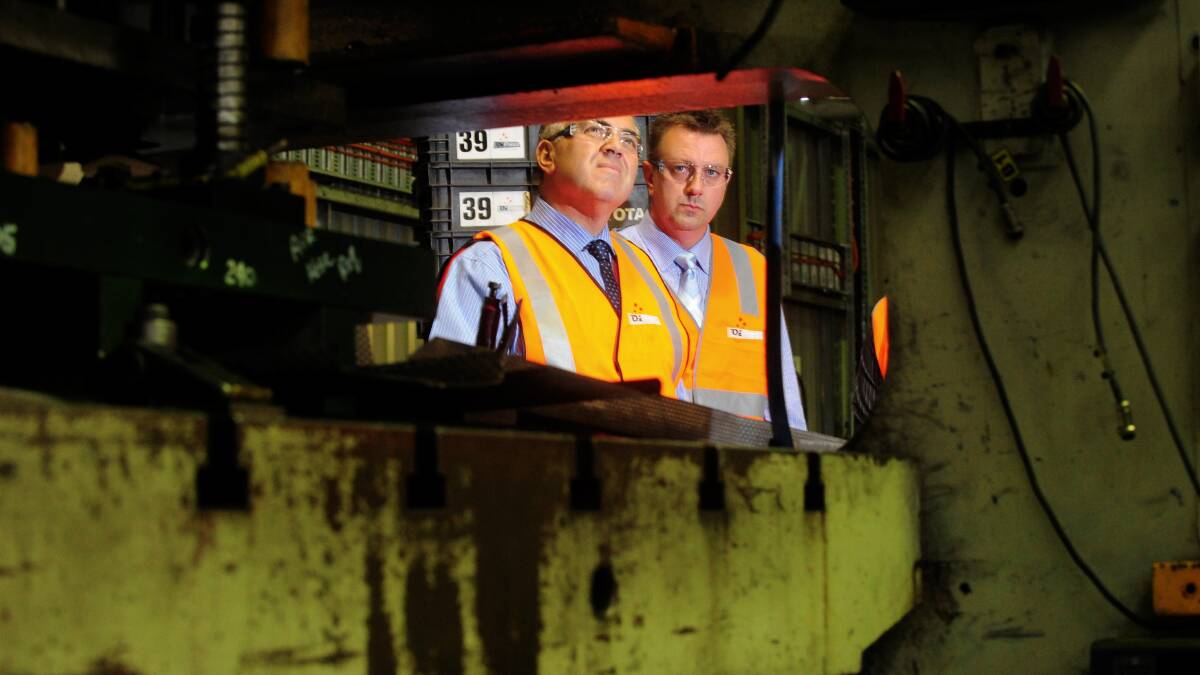 Then Shadow Treasurer Joe Hockey and former Liberal candidate for Ballarat John Fitzgibbon at car parts manufacturer Ozpress in Wendouree in 2013. The company has received a $16,000 grant from state government to identify new markets. 