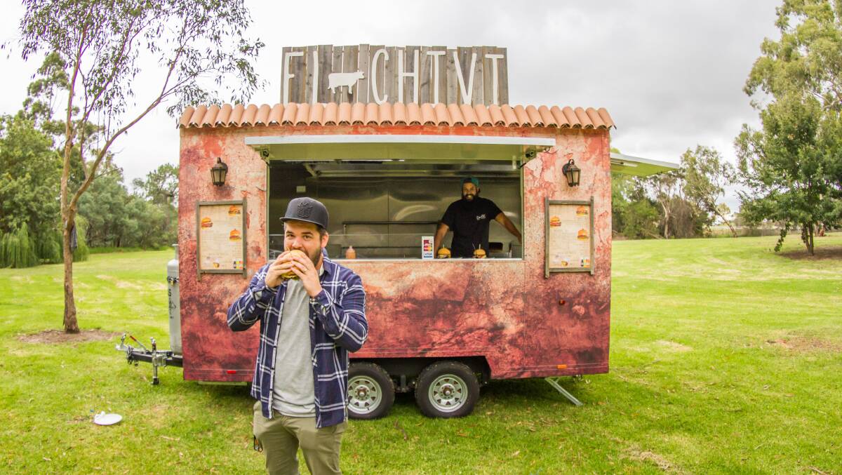 Food Truck Carnival organiser Danny Grant sampling a Uruguayan-inspired steak sandwich from the El Chivi food truck.