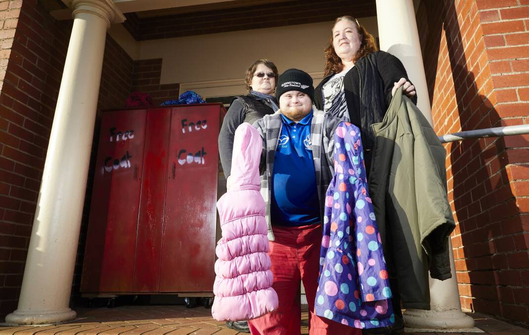 Bev Hobson, Taylor Kerry and Narelle Kerry at the Salvos coat exchange initiated for the first time this year to keep people warm in winter. Picture: Luka Kauzlaric.