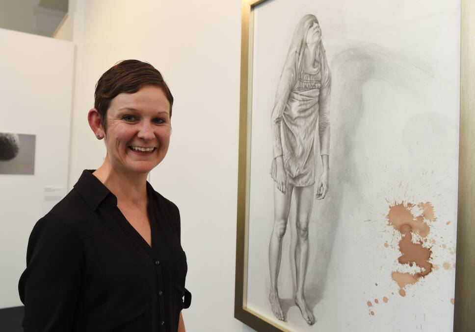 Double barrel: Ballarat artist Kim Anderson has taken out the Eureka Art Award's inaugural people's choice award. Picture: Lachlan Bence.
