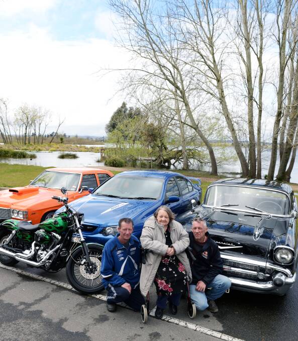 Full revs ahead: Darren and Sean Procter with their mum Joan and some of the entrants to the Ballarat Motor Show. Picture: Kate Healy.