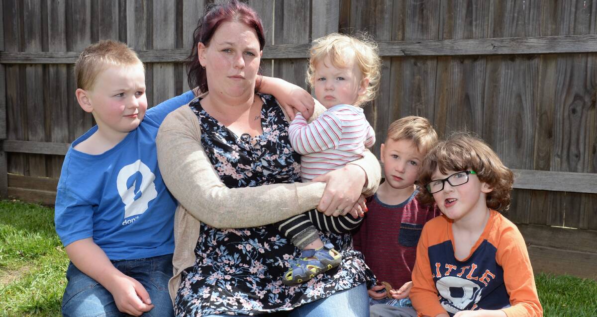 Housebound: Samantha Medbury with four of her five children at their Wendouree home. Harley, 8, Oliver, 3, Gabriel, 19 months, and Noah, 5. Picture: Kate Healy.