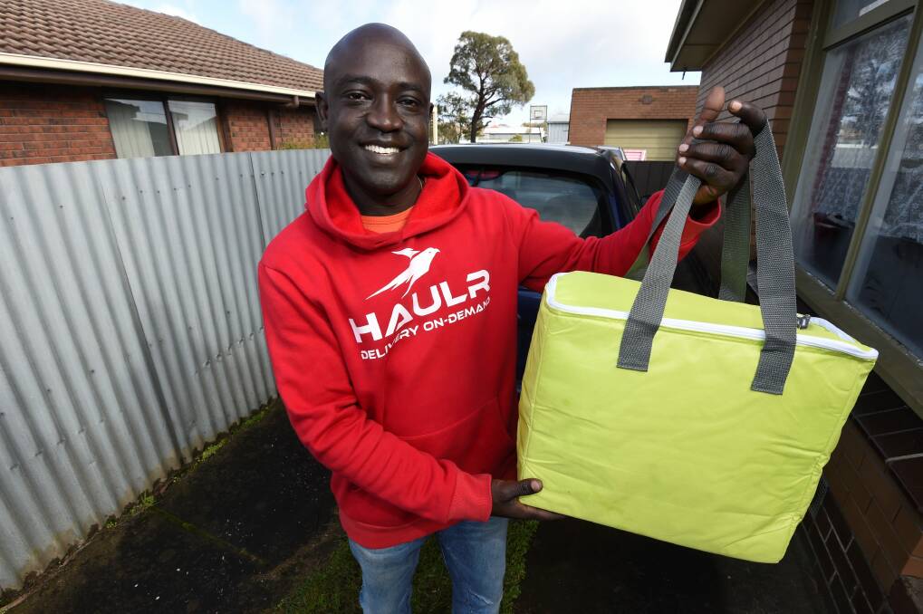 Demand: Haulr co-founder Simon Sebit says the service is delivering on average $3,500 a week in food and alcohol. Picture: Lachlan Bence. 