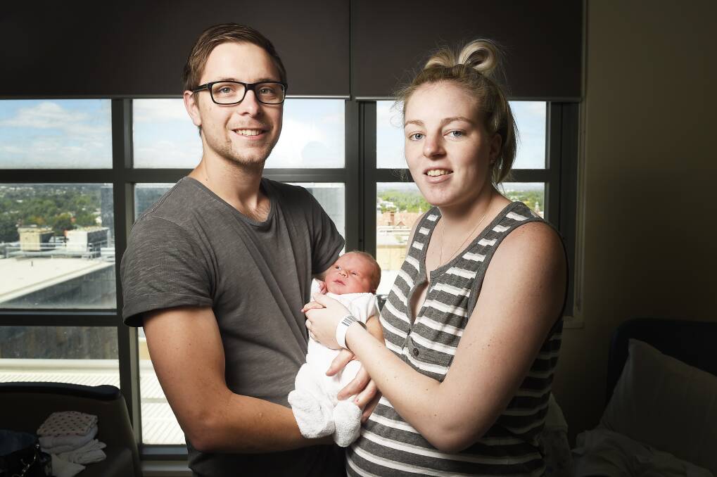 Brendan Wilcox and Tegan Hynes with their baby boy Arlo Wilcox, born Tuesday at 4.35pm. Picture: Luka Kauzlaric.