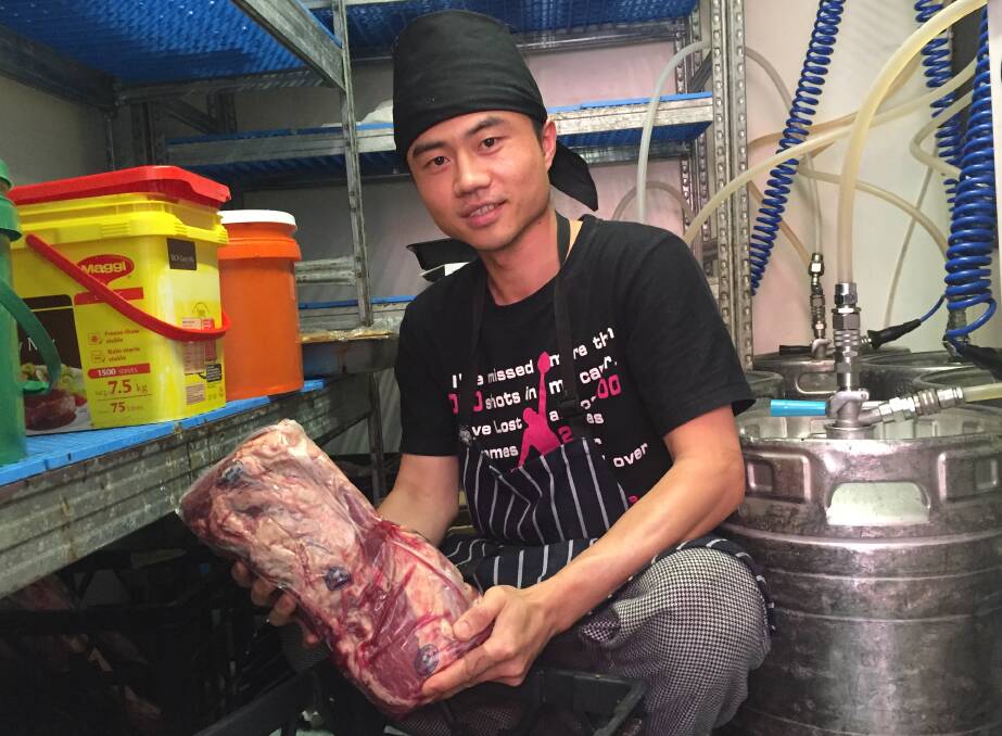 Royal Mail Hotel head chef Paul Zhu with a slab of meat similar to the steaks stolen from the pub's cool room on Christmas Eve. Picture: Jessica Black.