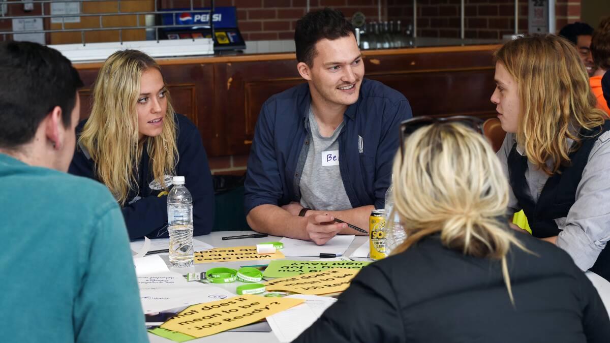 AFL players Kaitlyn Ashmore and Ben Mabon talk with Bayden Furness about barriers young people face getting into the workforce at a forum on Thursday. Picture: Kate Healy.