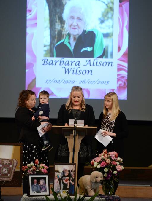 Farewell: Melanie Fulcher with Liam, Molly Baxter and Aimee Lofts deliver a tribute to their grandmother, Barbara Wilson during her memorial service. Picture: Kate Healy 
