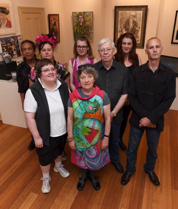 Faces and stories: Ismiadi, Melinda Mascat, Jessica Schrseter, Chloe Neath, Joel Gills, Lynden Nicholls, Peter Macdonald and Shane Boland are some of the local artists who have their work on display. Picture: Lachlan Bence
