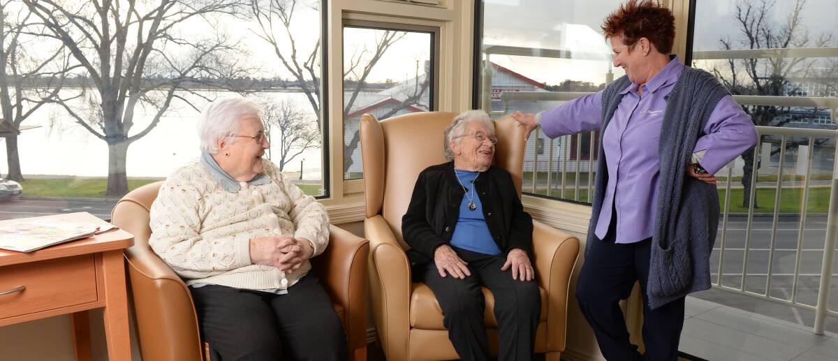 ROOM WITH A VIEW: Nazareth Care residents Mary Laffey and Julie Duffy with lifestyle and wellbeing assistant Judi Link in the new Basil Wing facility. Picture: Kate Healy