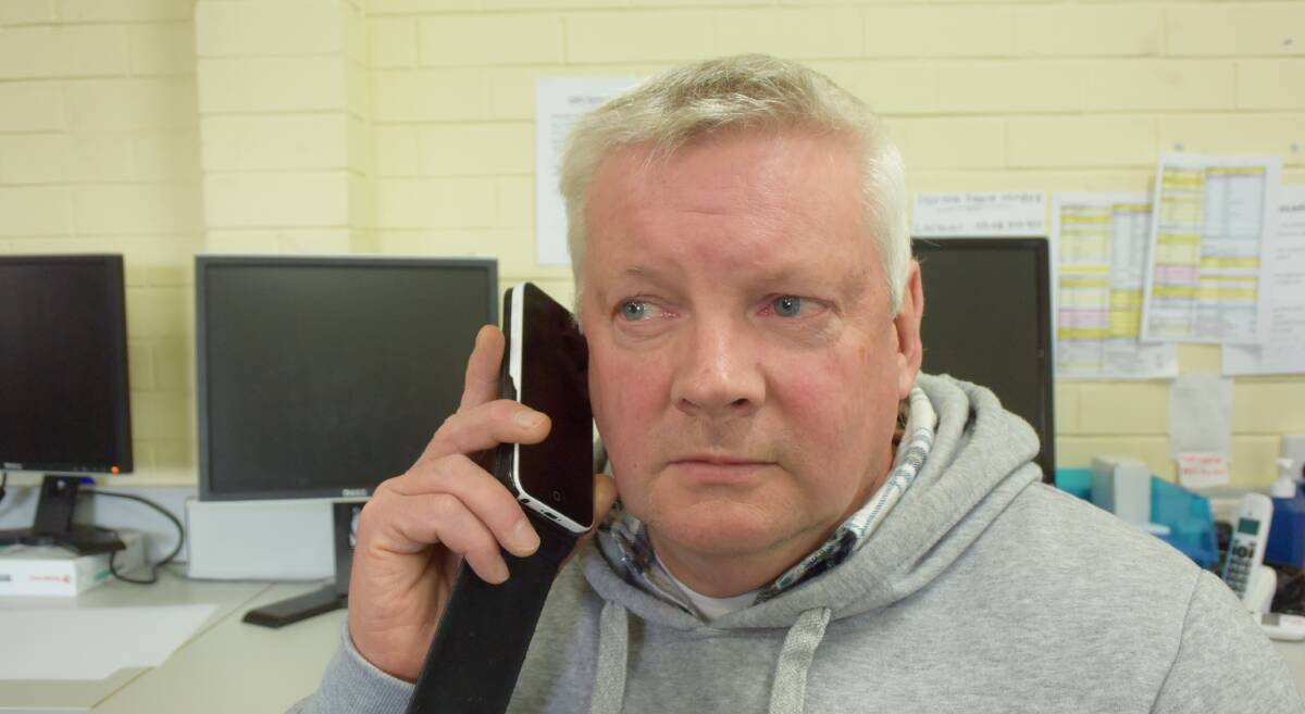 Gary Walters listens back to the telephone scam recording. Picture: SAM SHALDERS
