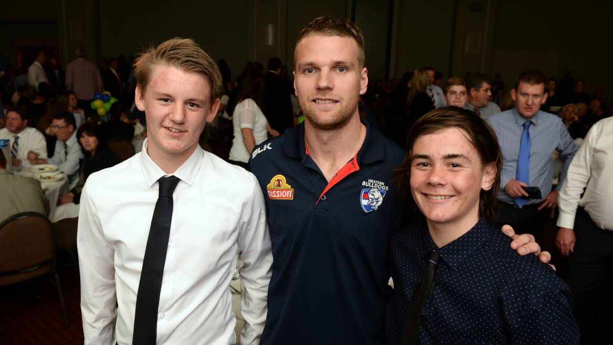 SPECIAL GUEST: Western Bulldogs key forward Jake Stringer with Liam Vercoe and Cooper Bath. Picture: Kate Healy