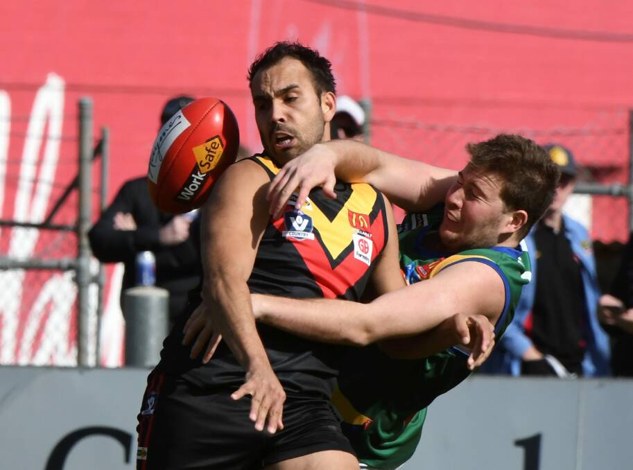 IN A TANGLE: Lake Wendouree ruckman Herb Herben spoils Jethro Calma-Holt, who finished the day with two goals for Bacchus Marsh. 