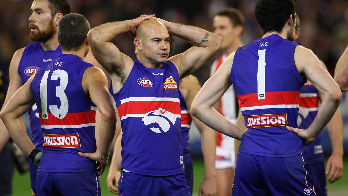 SHATTERED: Nathan Eagleton and his Western Bulldogs teammates ponder what might have been after their loss to St Kilda in a 2010 preliminary final. Picture: Getty Images    