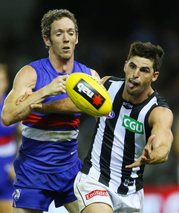 GOING AT IT:  Either Western Bulldogs captain Robert Murphy or Collingwood skipper Scott Pendlebury will hold aloft the Robert Rose Cup. Picture: Getty Images.