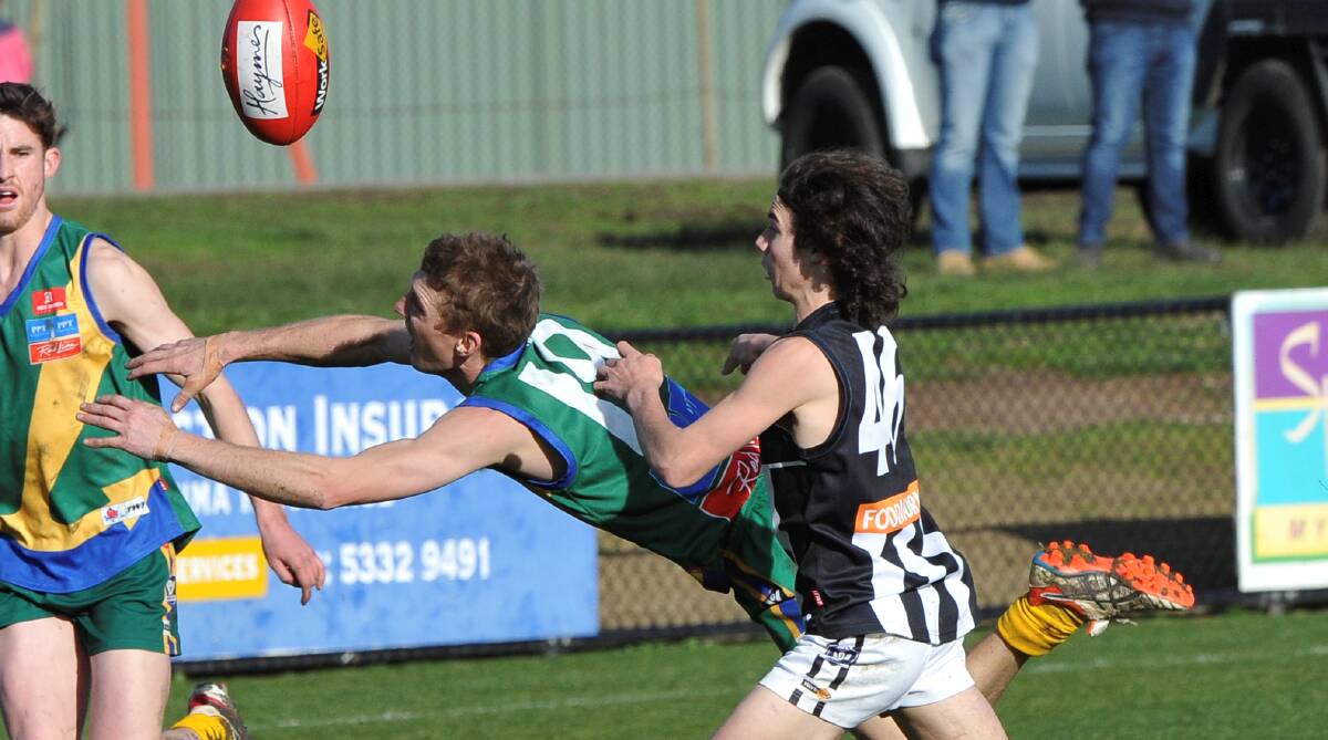 Darley hero Cooper Pepi forces Lake Wendouree's Luke Bucknall to rush the football towards safety. Picture: Lachlan Bence