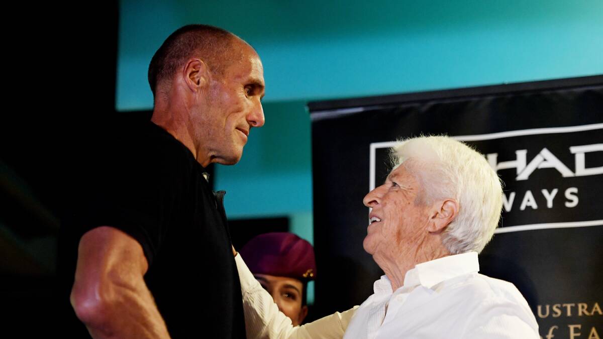 CHAMPIONS: Australian swimming legend Dawn Fraser inducts Tony Lockett in the Sports Australia Hall of Fame. Pictures: AAP Images