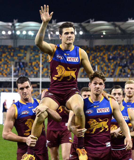 GOING: Jed Adcock acknowledges fans on reaching 200 games with Brisbane Lions in round 17 this season. Next week he will be waving goodbye. Picture: Getty Images