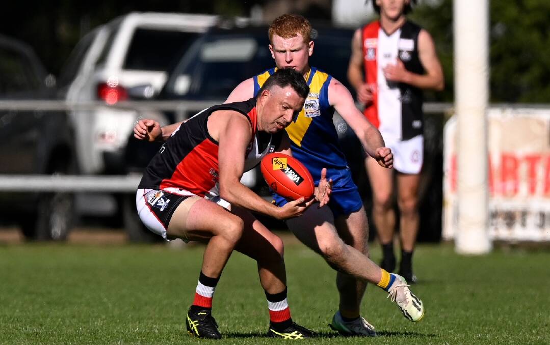 Two CHFL newcomers Marcus Hottes (Creswick) and Tom Mitchell (Learmonth) go at it at Learmonth. Picture by Adam Trafford.