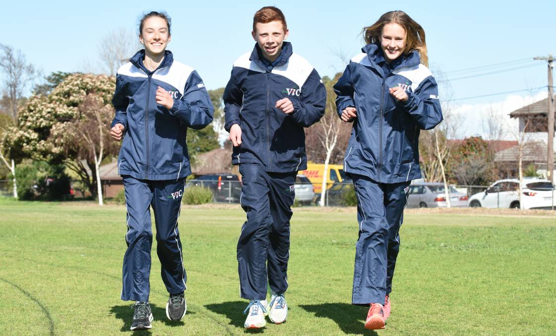 DEBUTS: Katherine Dowie, Matthew Catterson and Tahlee Van Roosmalen wearing Big V in national cross country championships for a first time.
