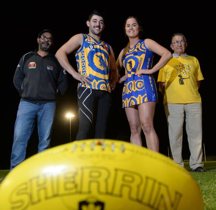 SPECIAL LOOK: Sebastopol players Geoffrey Lovett and Nikki Allen show off the  Burra's BFNL Indigenous Round design in company with Peter-Shane Rotumah, left, and Ted Laxton, who are members of the design team, "Pitcha Makin Fellaz". Picture: Kate Healy 
