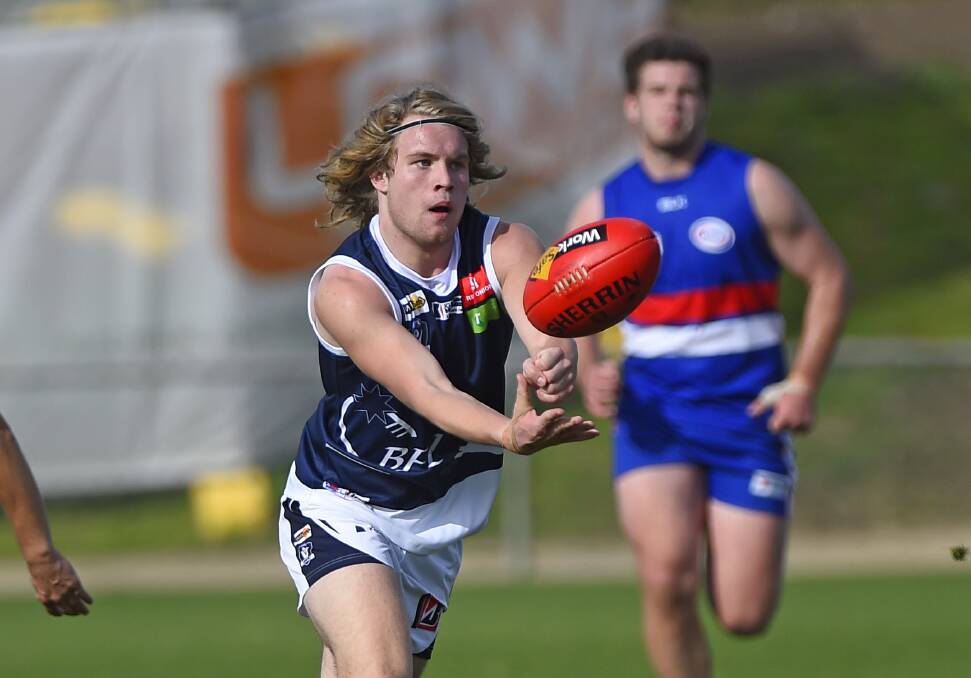 FEED: BFL's Alex Lovell finds an option by hand after getting out on his own against Western Region in the under-19 curtain-raiser.