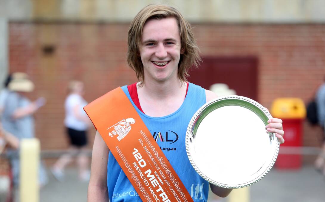 ALL SMILES: Ballarat teenager Mason Keast shows off the spoils off his restricted 120m win at Maryborough on Friday. Picture: Bendigo Advertiser