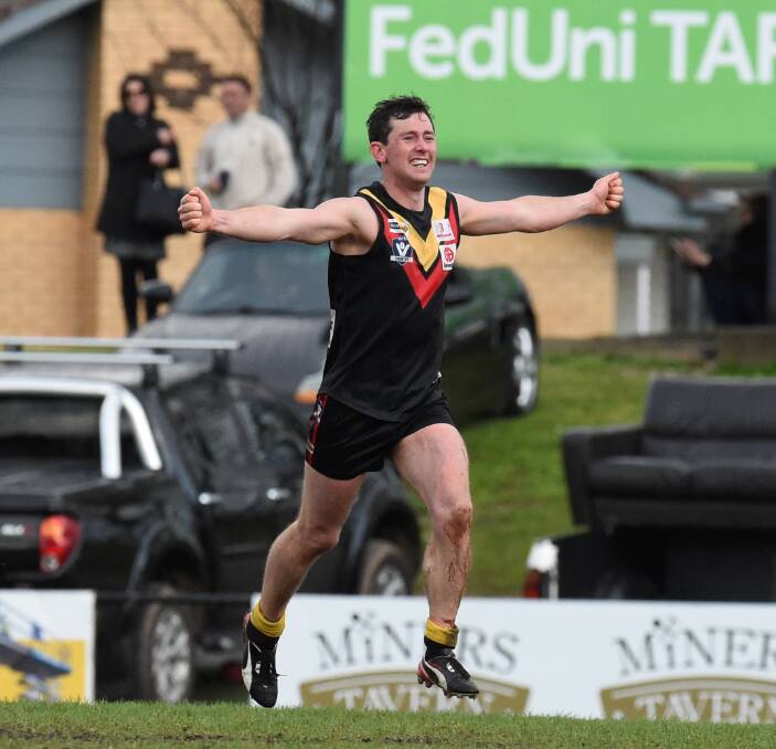 SIREN: Bacchus Marsh captain Tyson Shea begins the premiership celebration - the first the Cobras have had in the Ballarat Football League. Picture: Lachlan Bence
