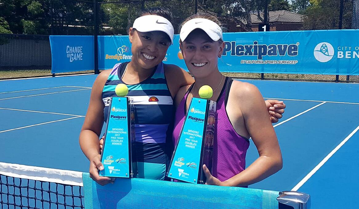 DELIGHTED: Zoe Hives and Alison Bai with their ITF Bendigo doubles title trophy