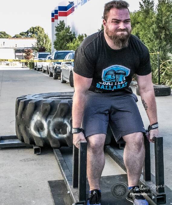 STRAINING: Ryan Bartok gives it all in the deadlift. Picture: Anthony Rogers 