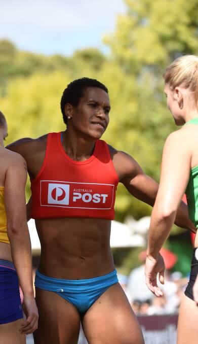 WELL DONE: Papua New Guinean Toea Wisil is congratulated by fellow competitors after winning a heat from scratch at Central Park on Saturday. Picture: Lachlan Bence.