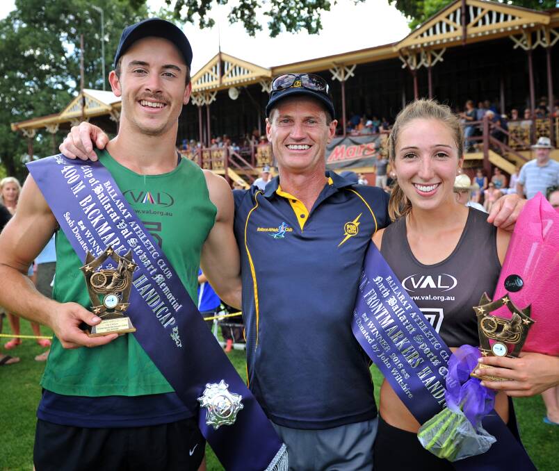 DOUBLE JOY: Ballarat coach Peter O'Dwyer with 400m winners Caleb McGrath and Tara Domaschenz on Sunday. Picture: Dylan Burns
