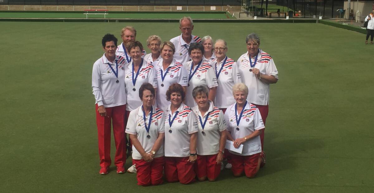 PREMIERS: Central Wendouree players proudly display their midweek pennant division one premiership medallions at Ballarat Bowling Club.