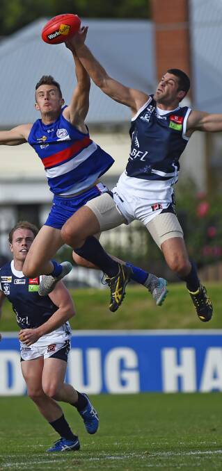 HIGH FLYERS: Ben Sortino was tireless in the ruck for Ballarat, breaking even with everything Western Region threw at him. Pictures: Luka Kauzlaric