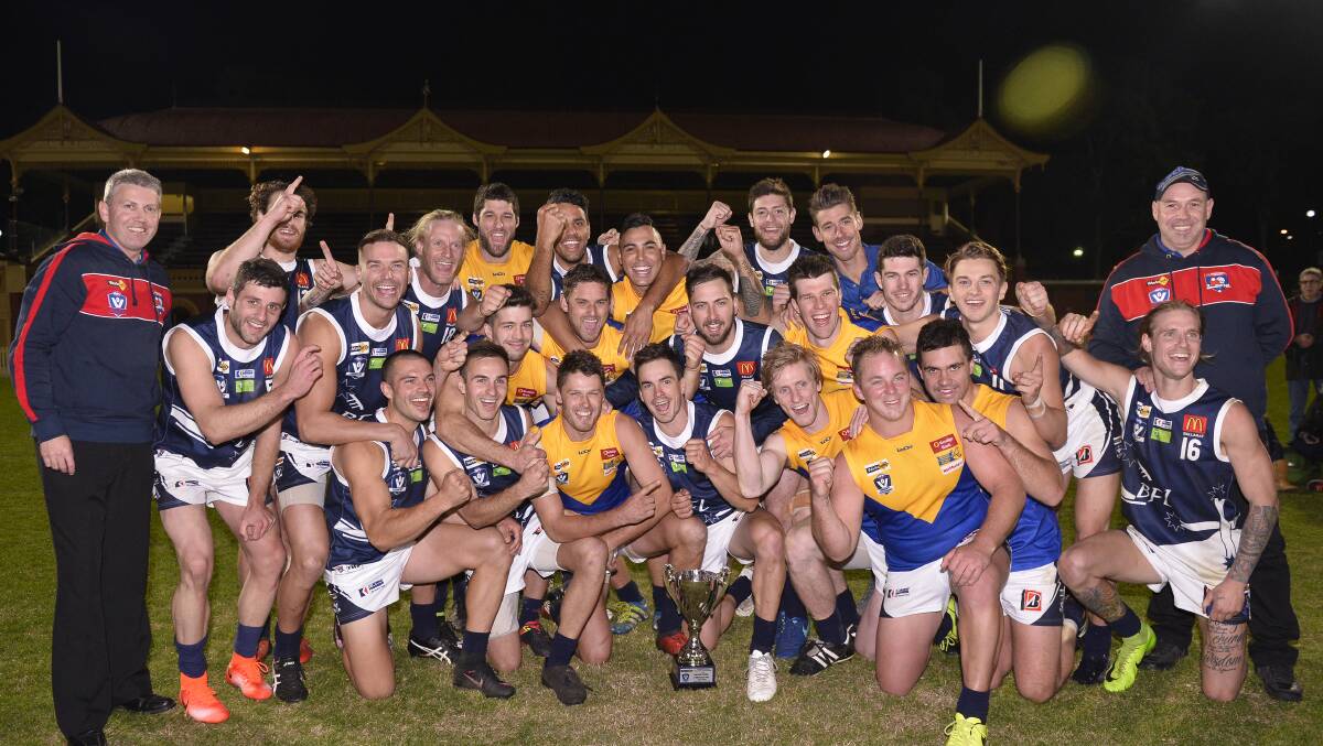 The Ballarat Football League celebrates its latest piece of silverware. Picture: Dylan Burns