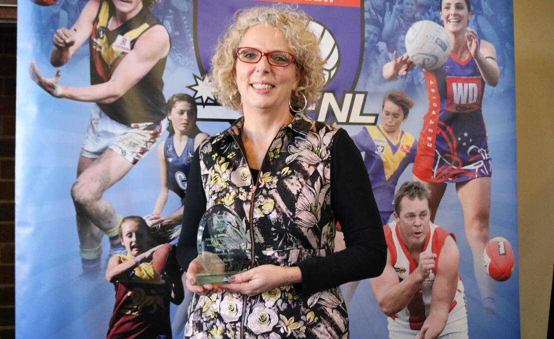 RECOGNITION: Karen Baker with the Ballarat Football Netball League woman of the year award.