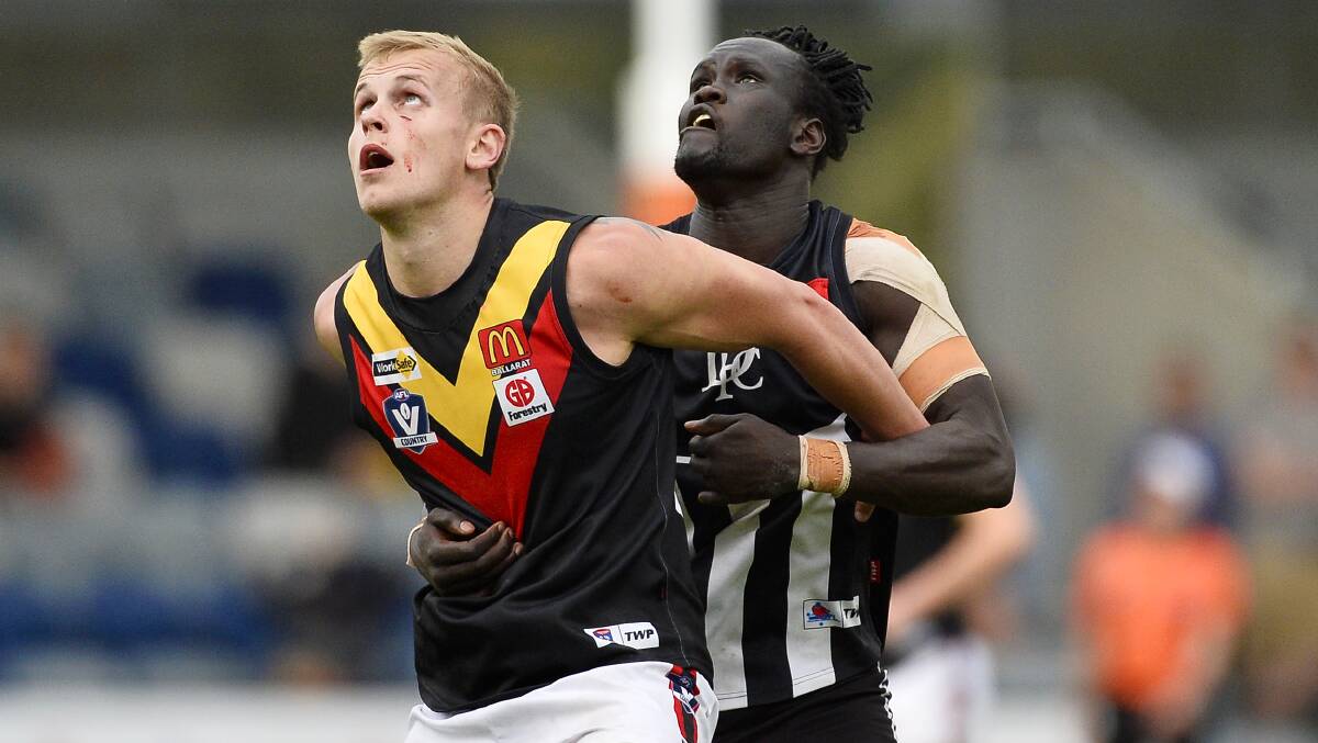 Bacchus Marsh ruckman Daniel Burton tussles with Abe Kur in a lively battle. Picture: Dylan Burns
