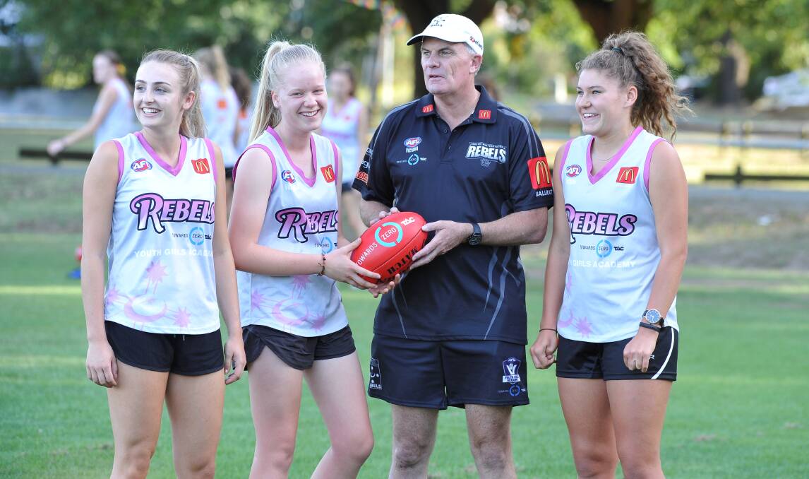 ALL SET: Head coach Jeff Whittaker with Amy McDonald, Lauren Butler and Jazz Kawa. Picture: Lachlan Bence