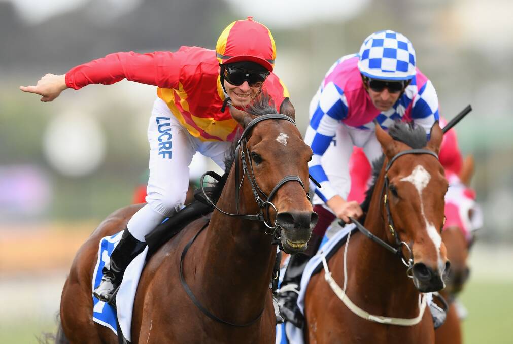 DELIGHT: Ben Melham gives a victory salute on Malaguerra in the Darley Classic at Flemington. Picture: Getty Images 