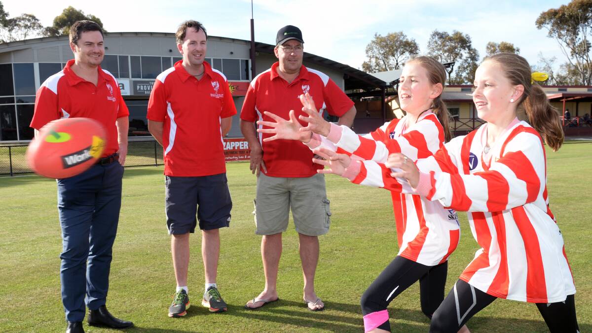 NEW ERA: Luke Brennan Rob Simmonds and Karl Drever with Ballarat Swans girls' under-13 players Meg Drever, 11, and Kate Wilding, 11. Picture: Kate Healy
