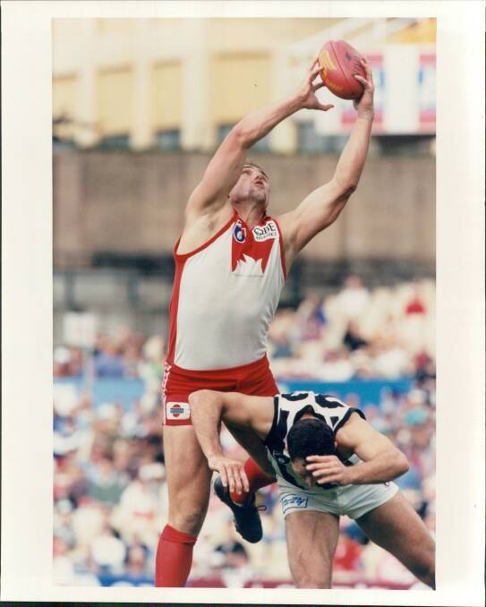 IN HIS PRIME: Tony Lockett at his high-flying best for Sydney during his 98-game career with the Swans.