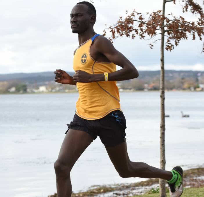 CONFIDENT: Duer Yoa strides out on his way to another Ballarat Regional Athletic Centre "Steve Moneghetti" lap of the lake title. He will be back at the venue in Saturday's XCR'16 15km road race. Picture: Neville Down