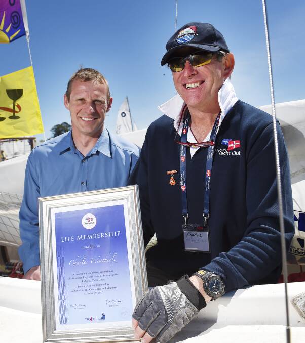 AWARD: Ballarat Yacht Club commodore Neville Bilney, left, and new life member Charles Weatherly. Picture: Luka Kauzlaric 