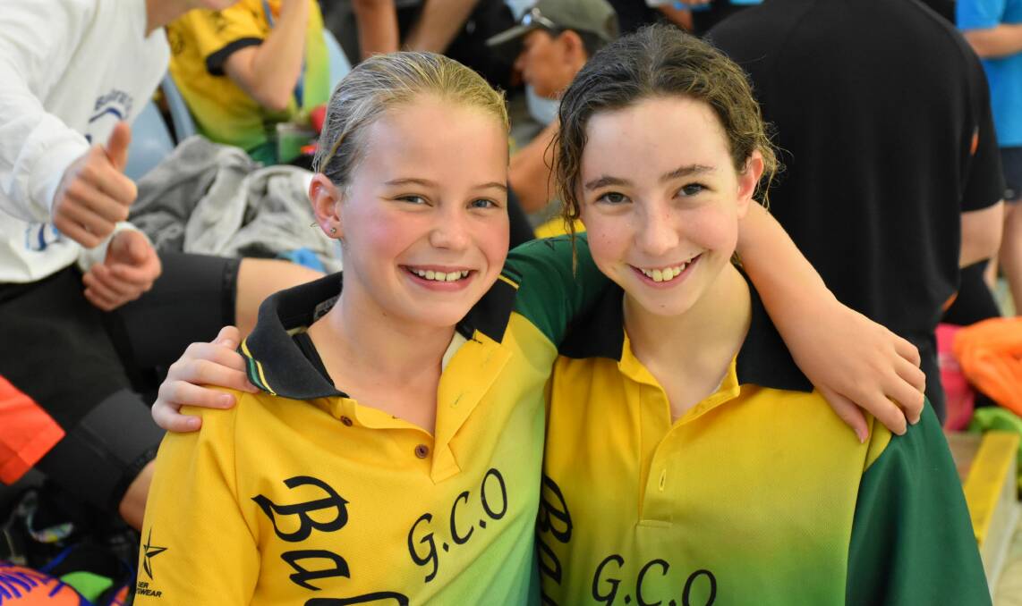 QUALIFIERS:  Taylor Mason and Madeline Pryor from Ballarat GCO celebrate making finals at the Tasmanian Swimming Championships.