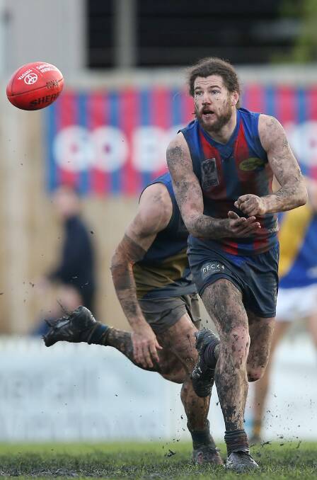 BOGGED DOWN: Toby Pinwill from Port Melbourne covered in mud against Williamstown on Saturday. Picture: Getty Images