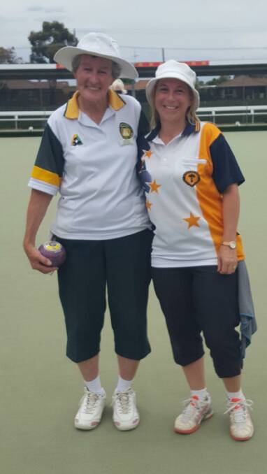 FRIENDLY RIVALRY: Kyneton Golf's Dione Andrews, left, with Helen Slater (Buninyong) after the group women's novice singles final.